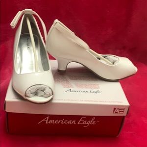 A pair of, never worn, American Eagle shoes.